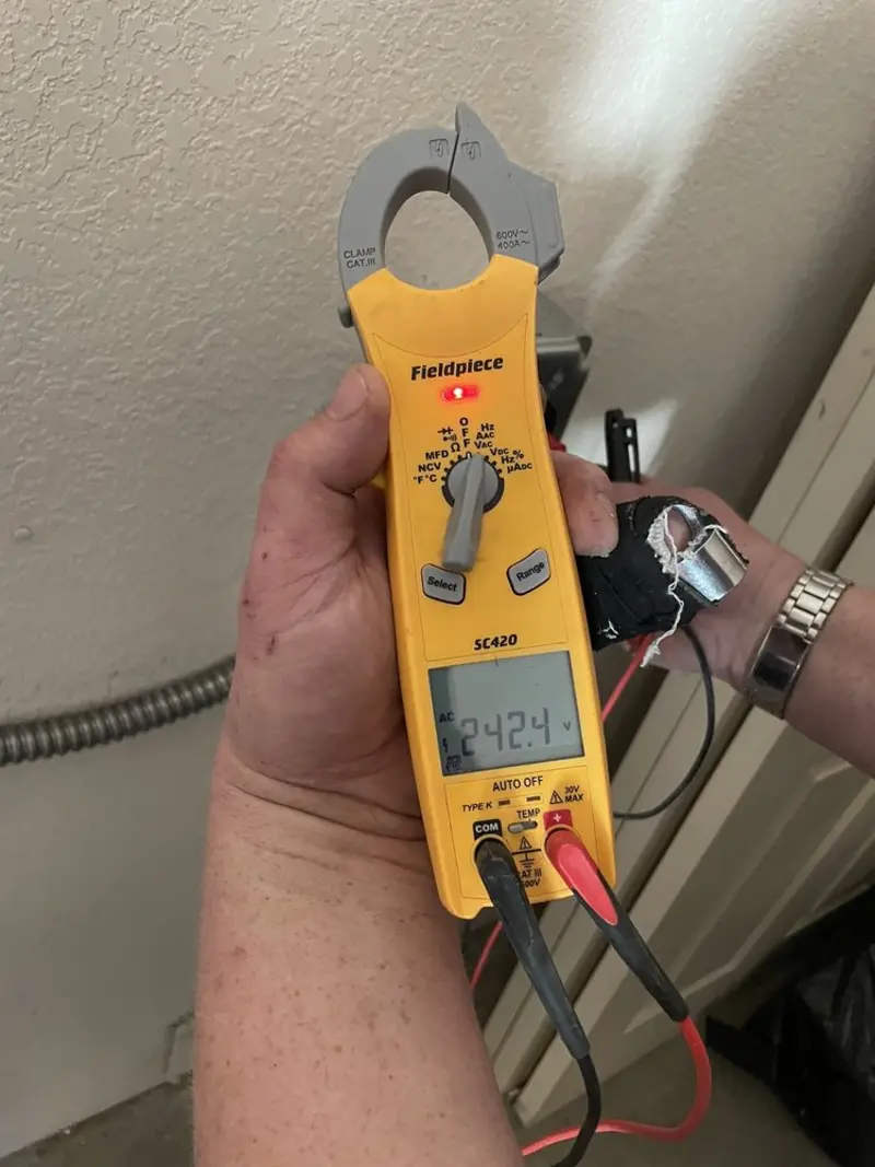 Voltage testing with clamp meter during Recessed Lighting Installation in Wilmington